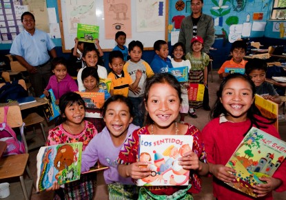 Children smiling with books Children smiling with books